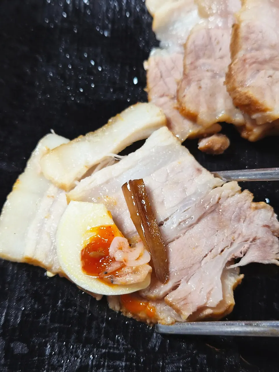 Glossy, juicy pork belly herbal bossam