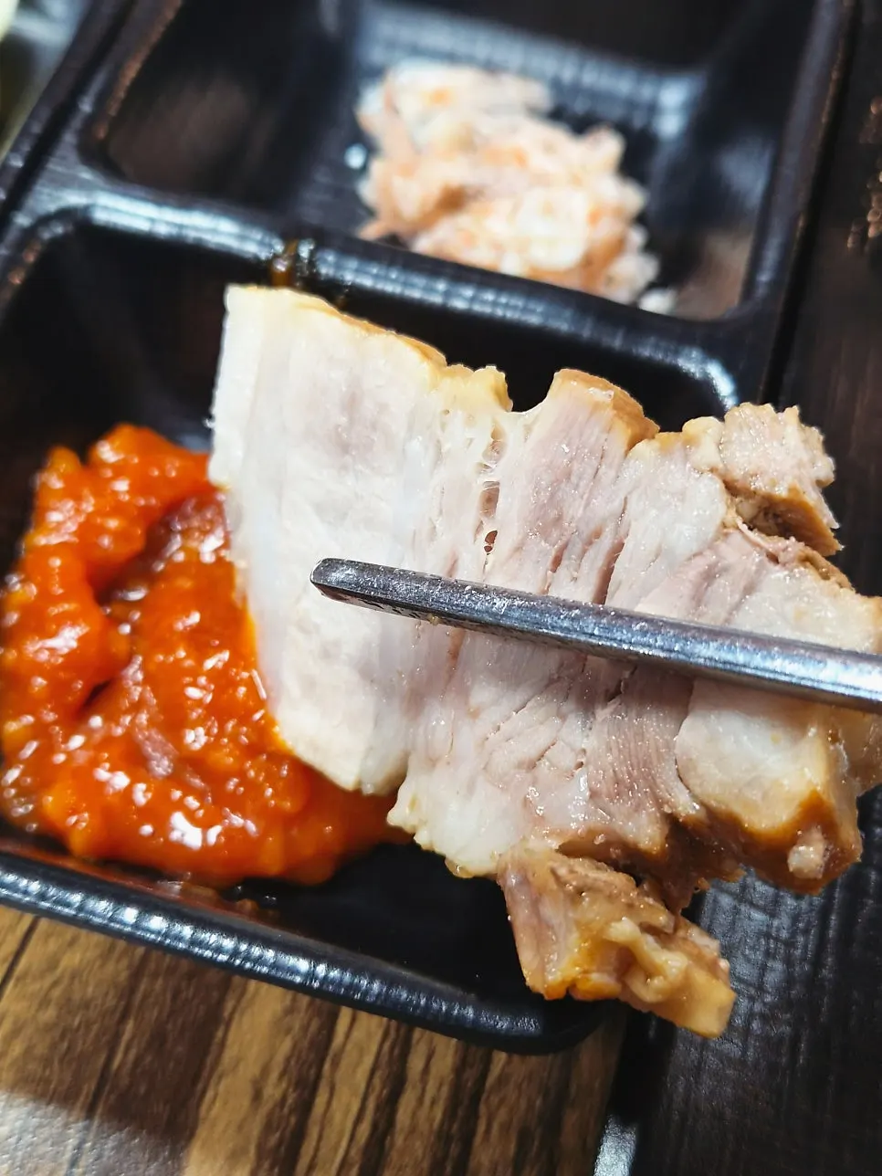 A bite of bossam with a hint of herbal medicine aroma