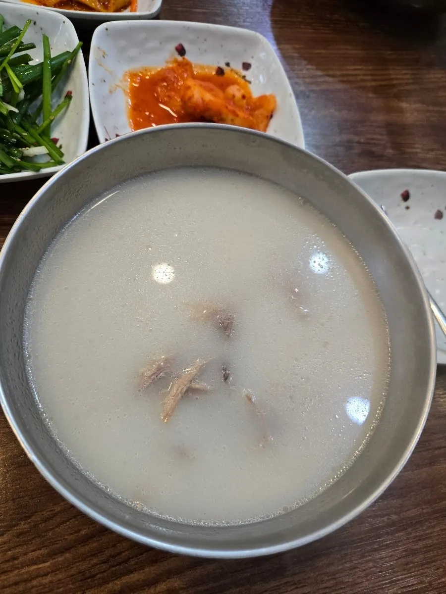 Knife-cut noodles lifted up from the yukkal-myeon bowl