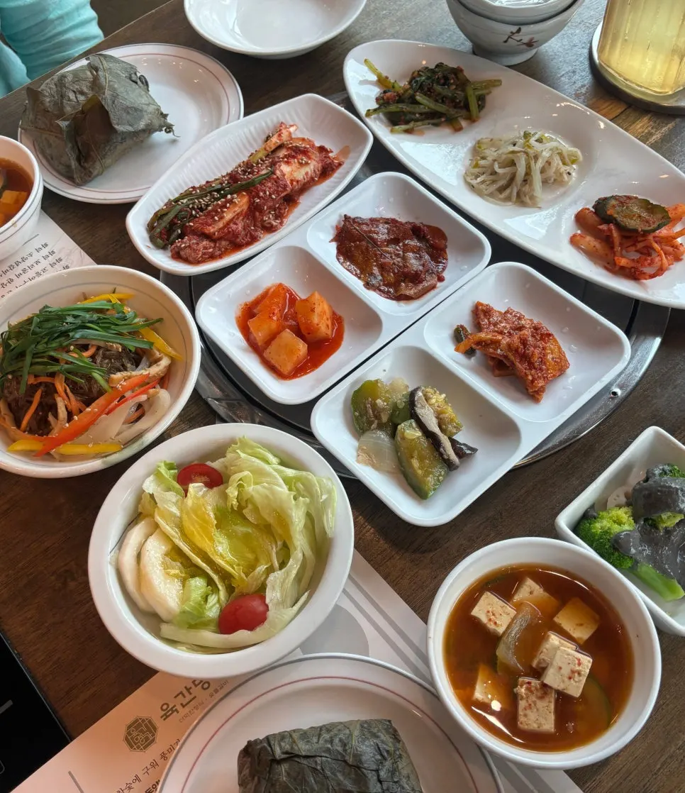 A table full of Korean set-meal side dishes