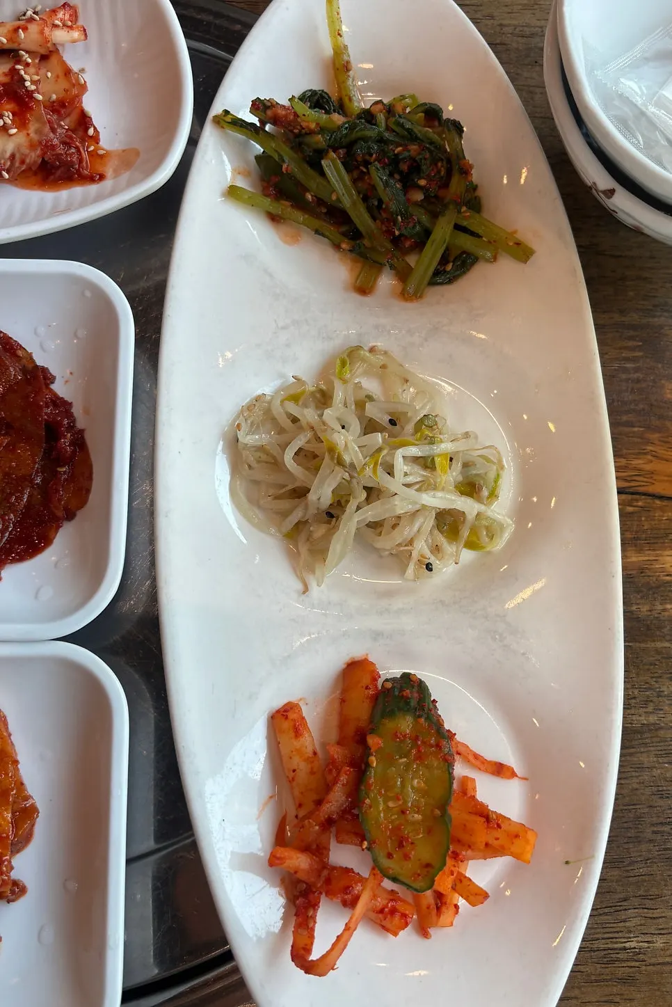 Table setting with kimchi and other side dishes