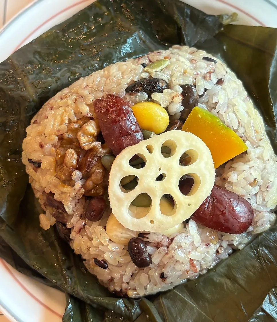 Warm lotus-leaf rice served at the table