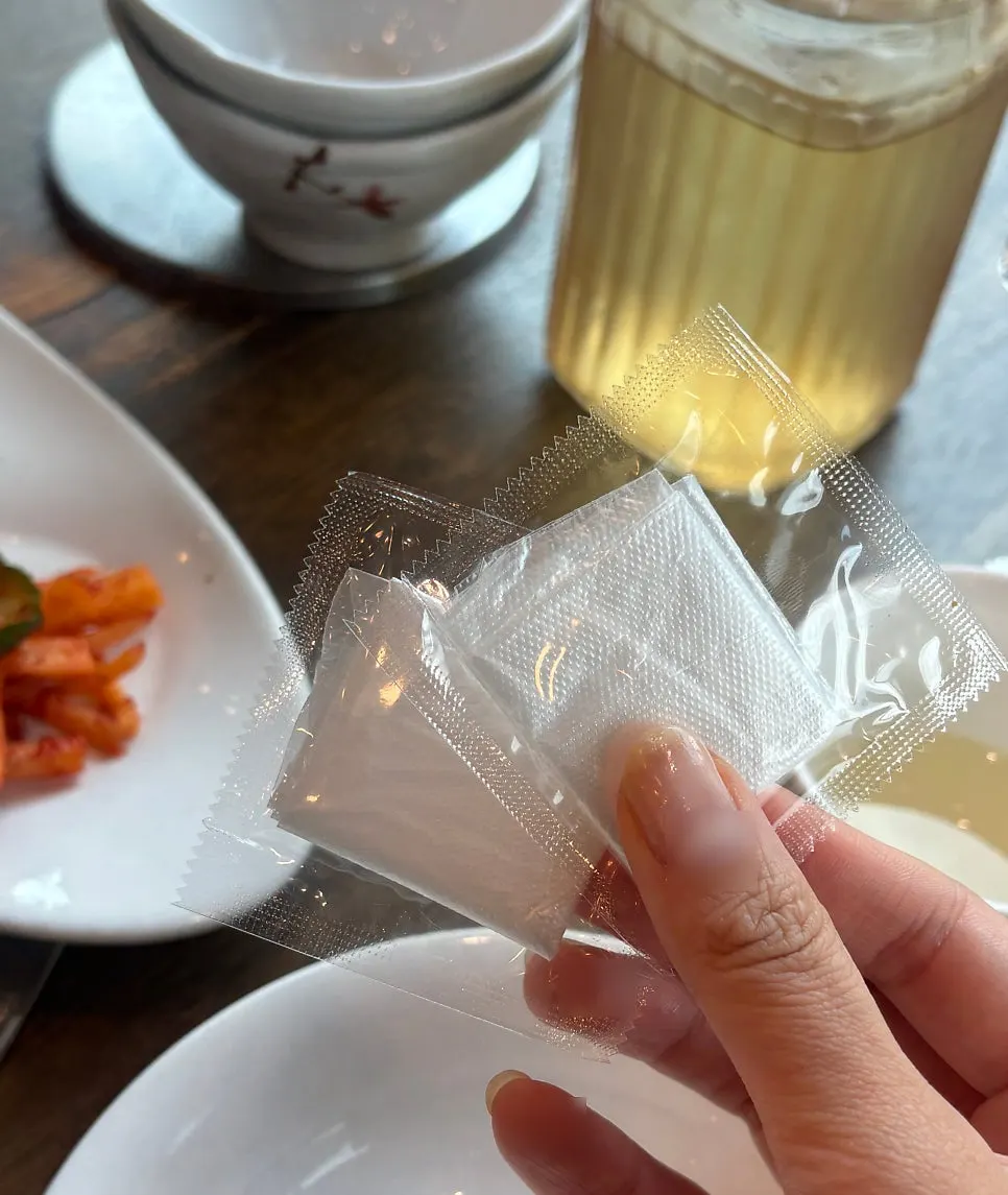 Green tea water served alongside the bori-gulbi