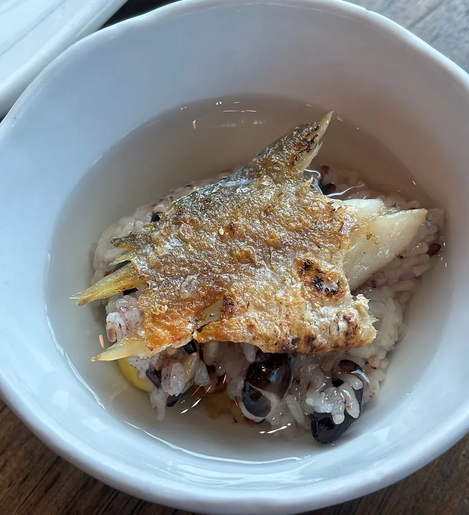 A piece of bori-gulbi placed over green tea rice