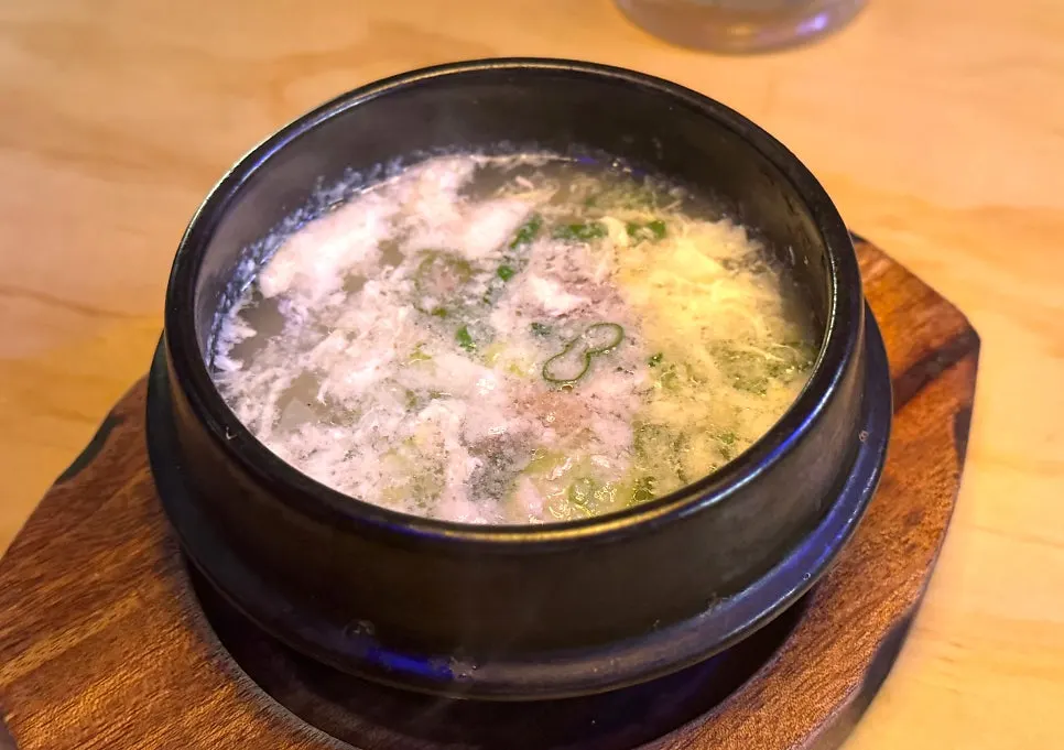 Menu board listing Yukhoe Gongjakso's sets and individual dishes