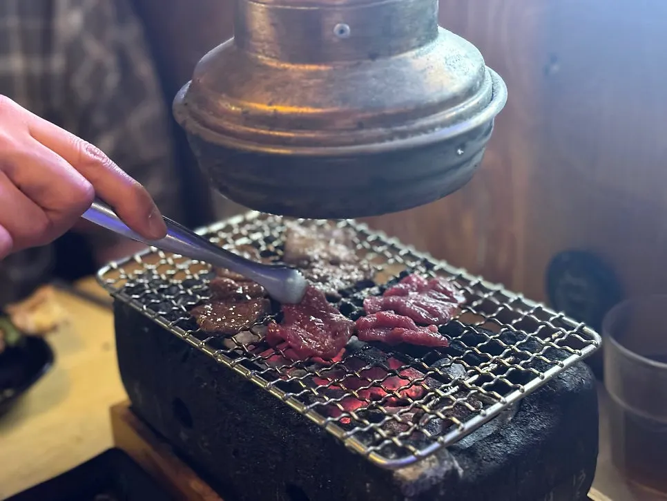 Chicken skewers grilling on the brazier