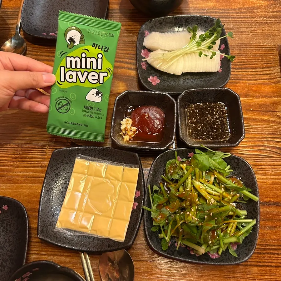 Achilles beef sashimi served with cheese, seaweed, and pear
