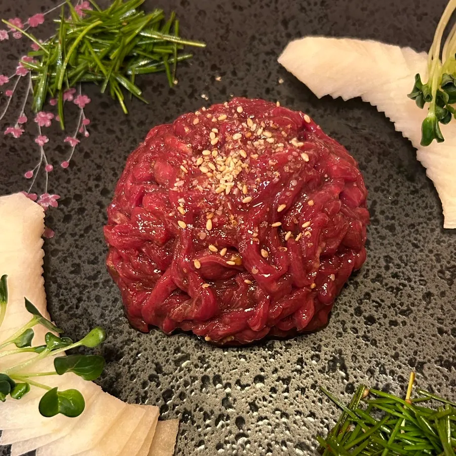Table spread with yukhoe and beef sashimi together