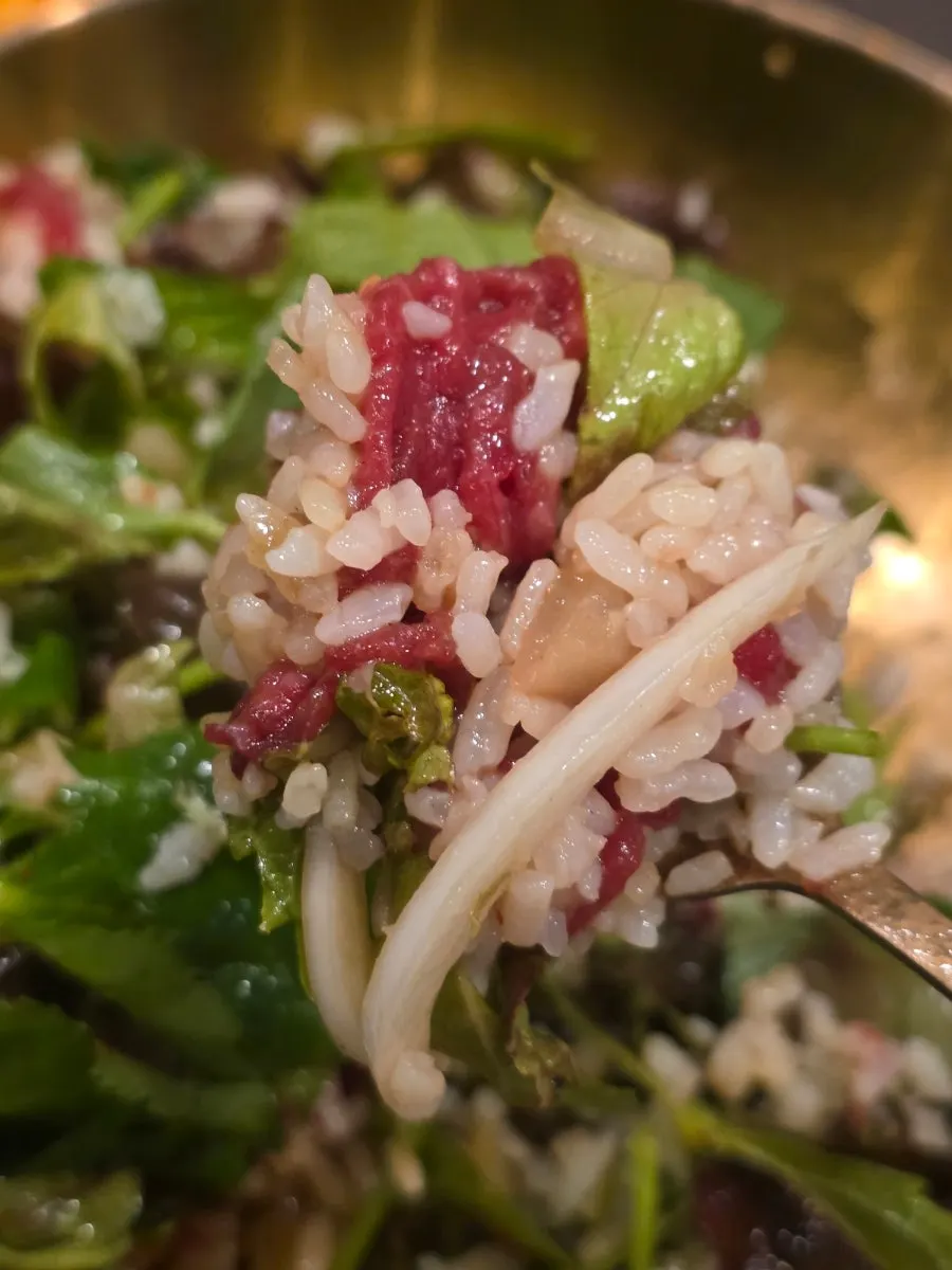 A spoonful of mixed hanwoo yukhoe bibimbap