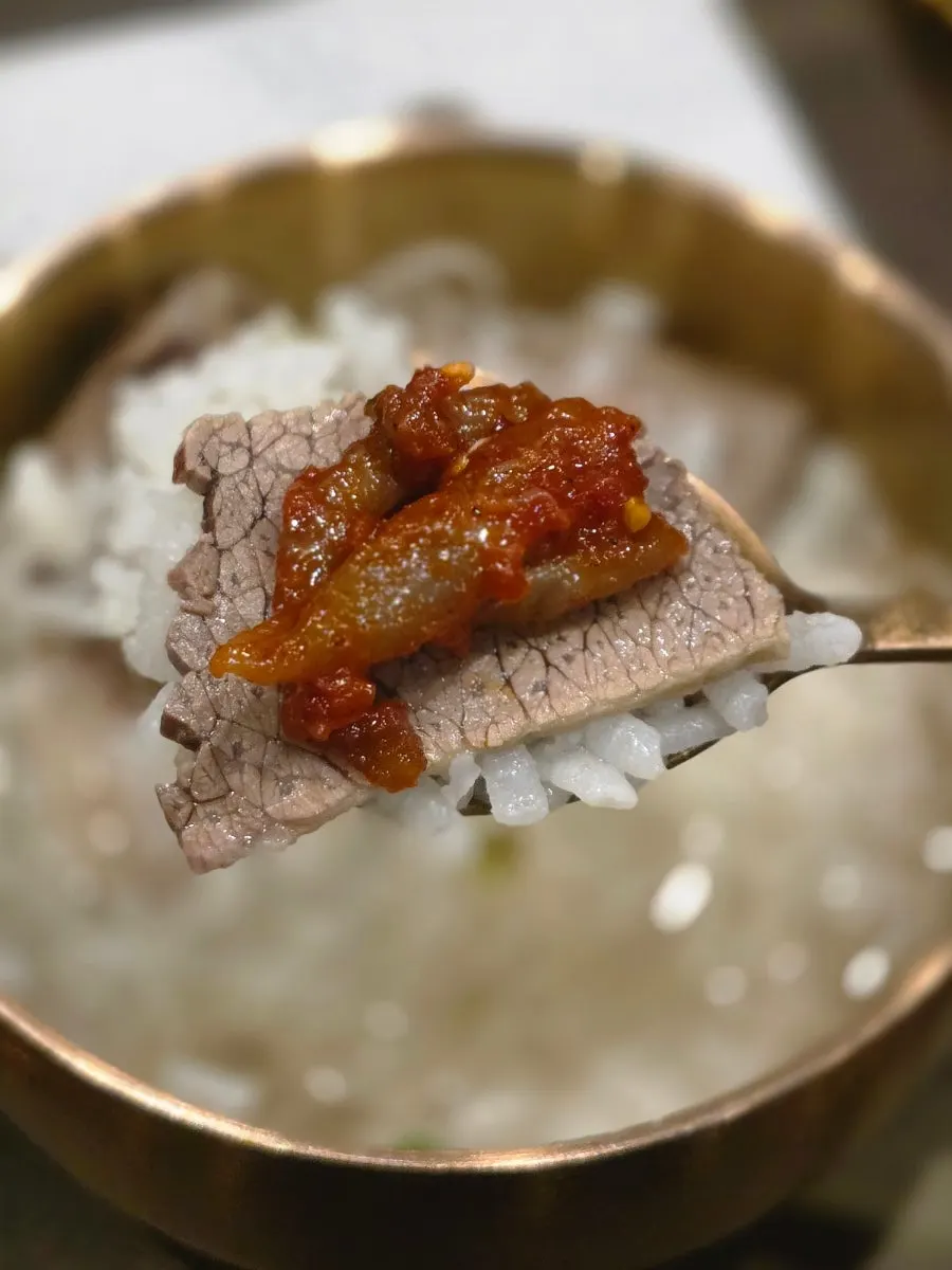 Eating hanwoo gomtang with added noodles