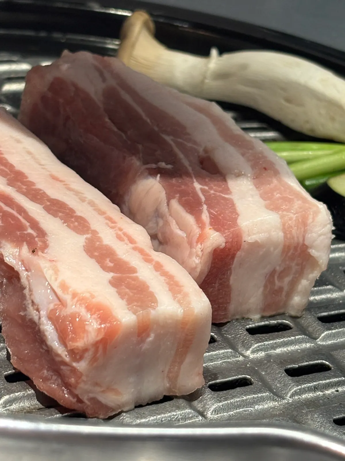 Whole pork belly on Yukjjip's charcoal grill plate