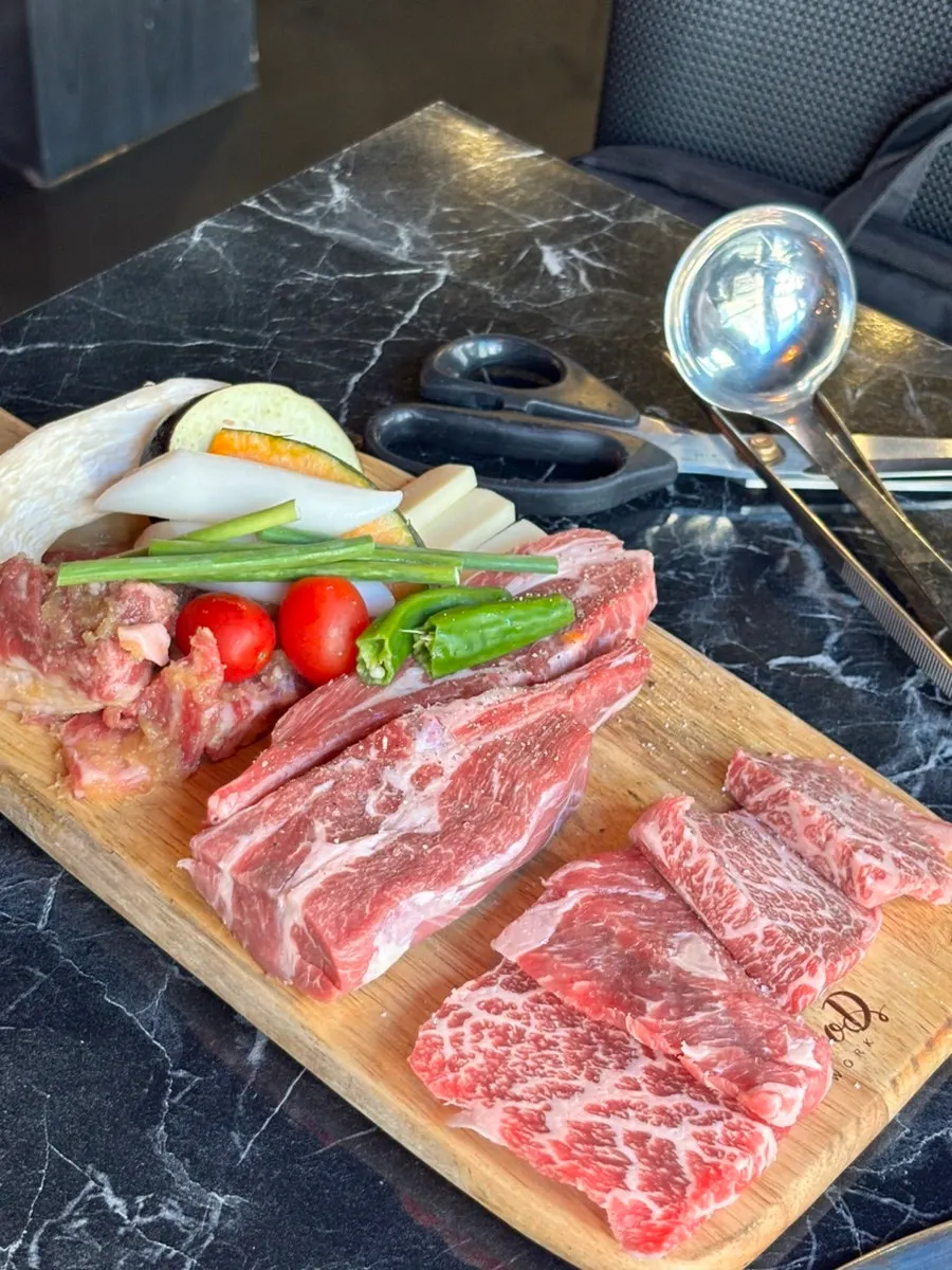 Seasoned galbi, lamb ribs, and jingalbisal making up the set