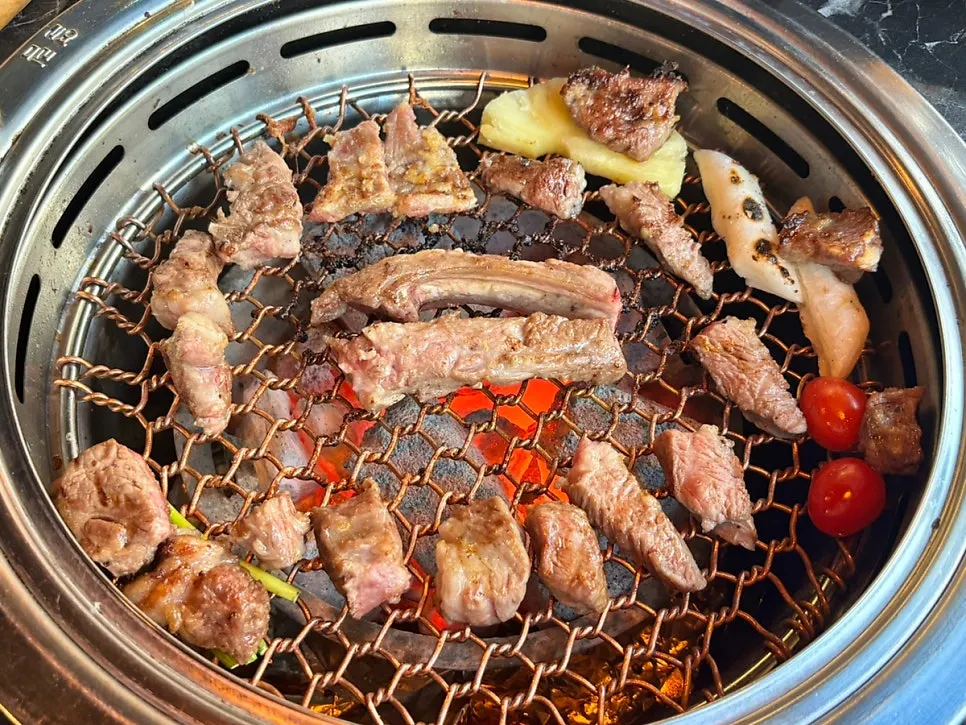 Grill plate with vegetables and cheese cooking together