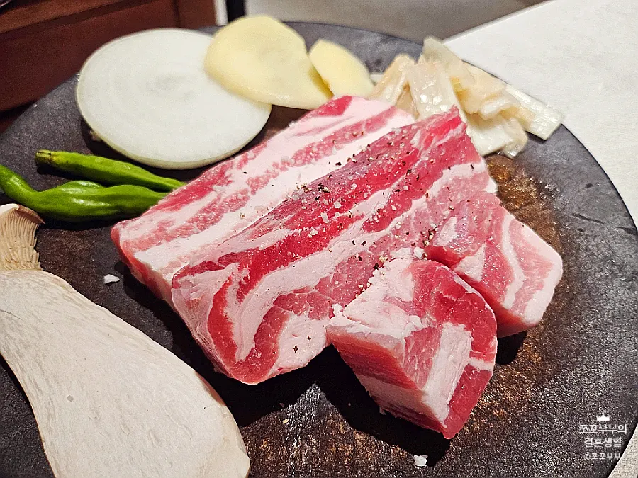 240-hour aged pork belly on the grill