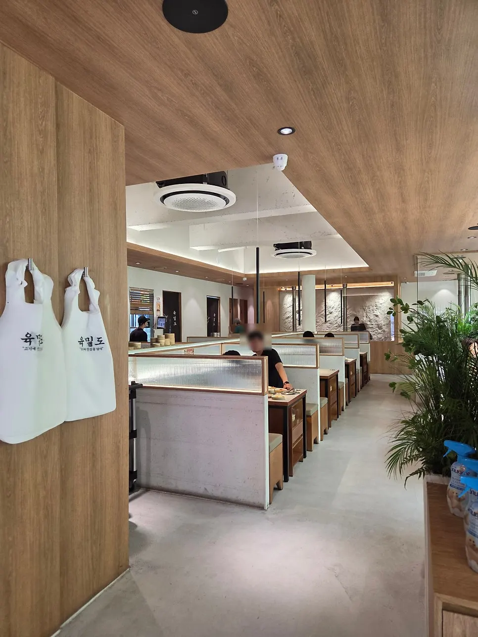 Interior seating at Yukmildo Dongnae Direct Branch divided by partitions