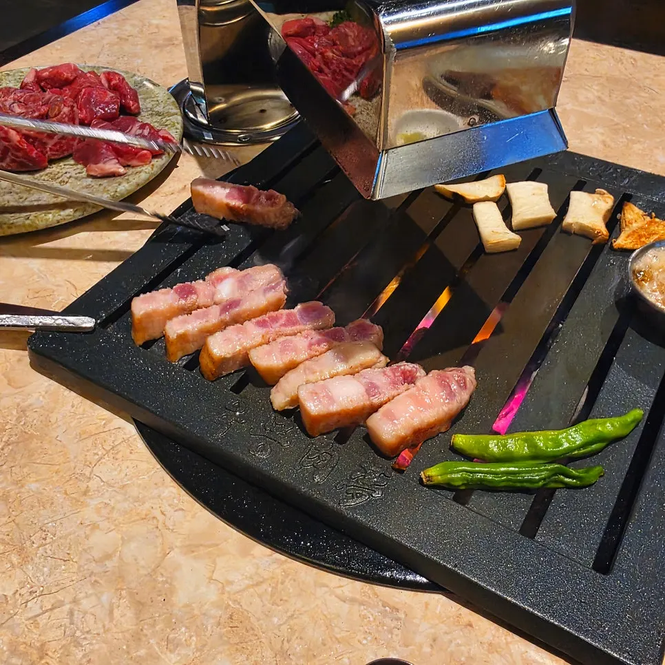 Different cuts cooking on the grill