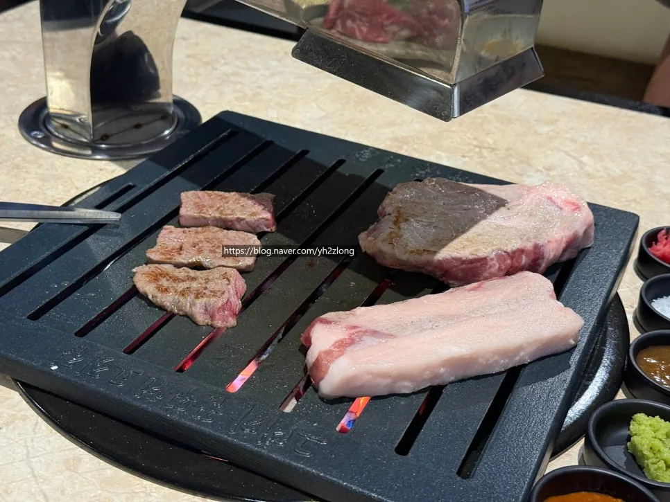 Meat and side dishes set on the grill