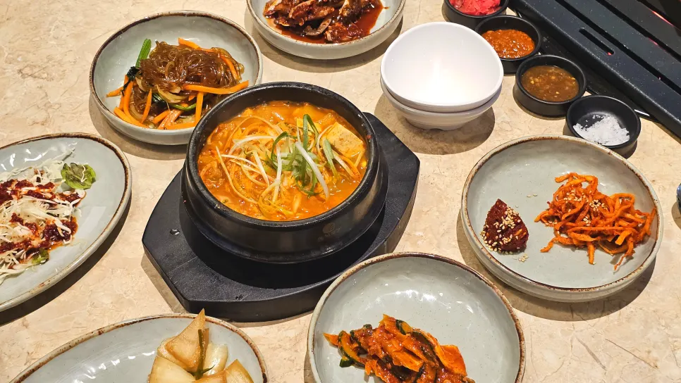 Banchan side dishes set out after ordering meat