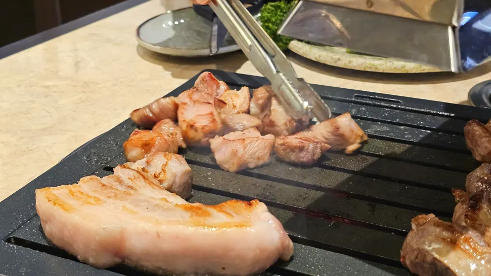 Raw pork cuts from the sampler set showing marbling