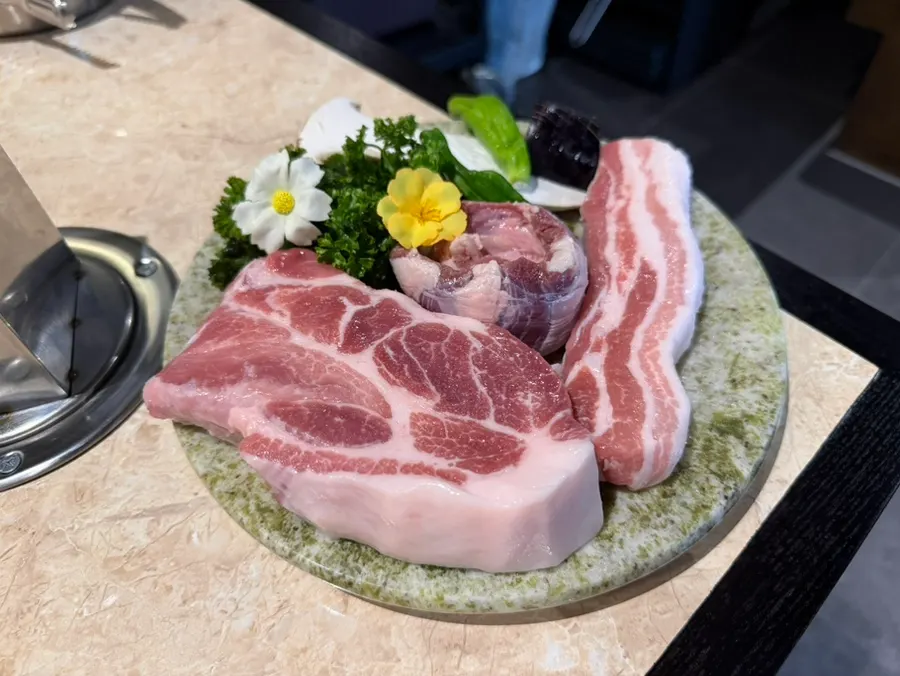 Korean pork sampler with pork belly, pork neck, and skirt meat