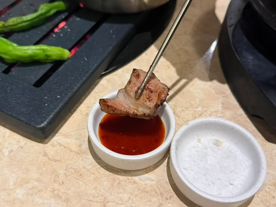 Grilled meat dipped in salt and soy sauce
