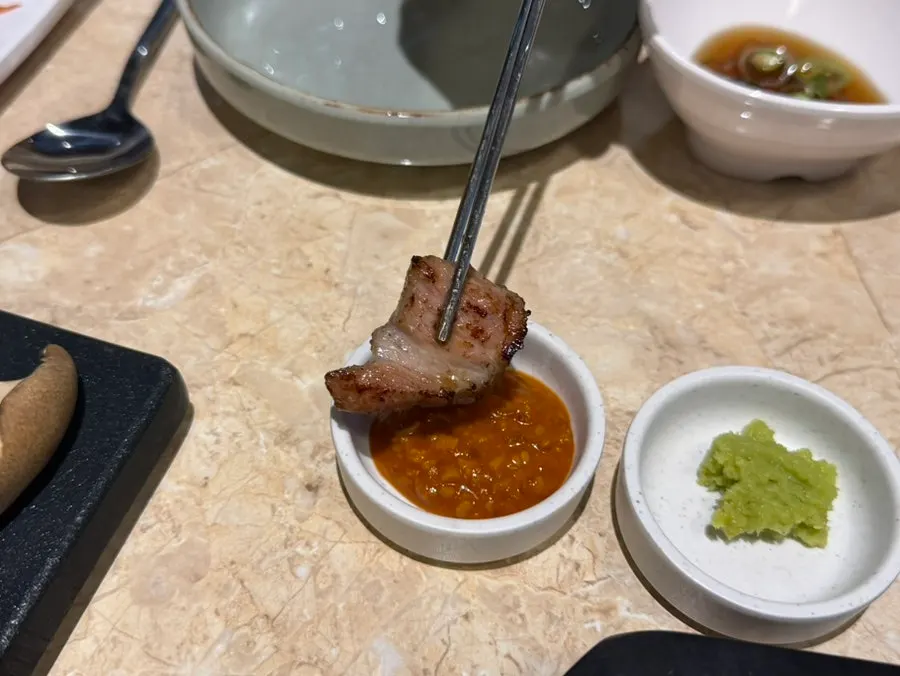 Fully cooked meat plated on a side dish
