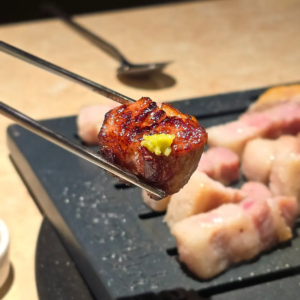 Grilled pork neck cut into bite-sized pieces