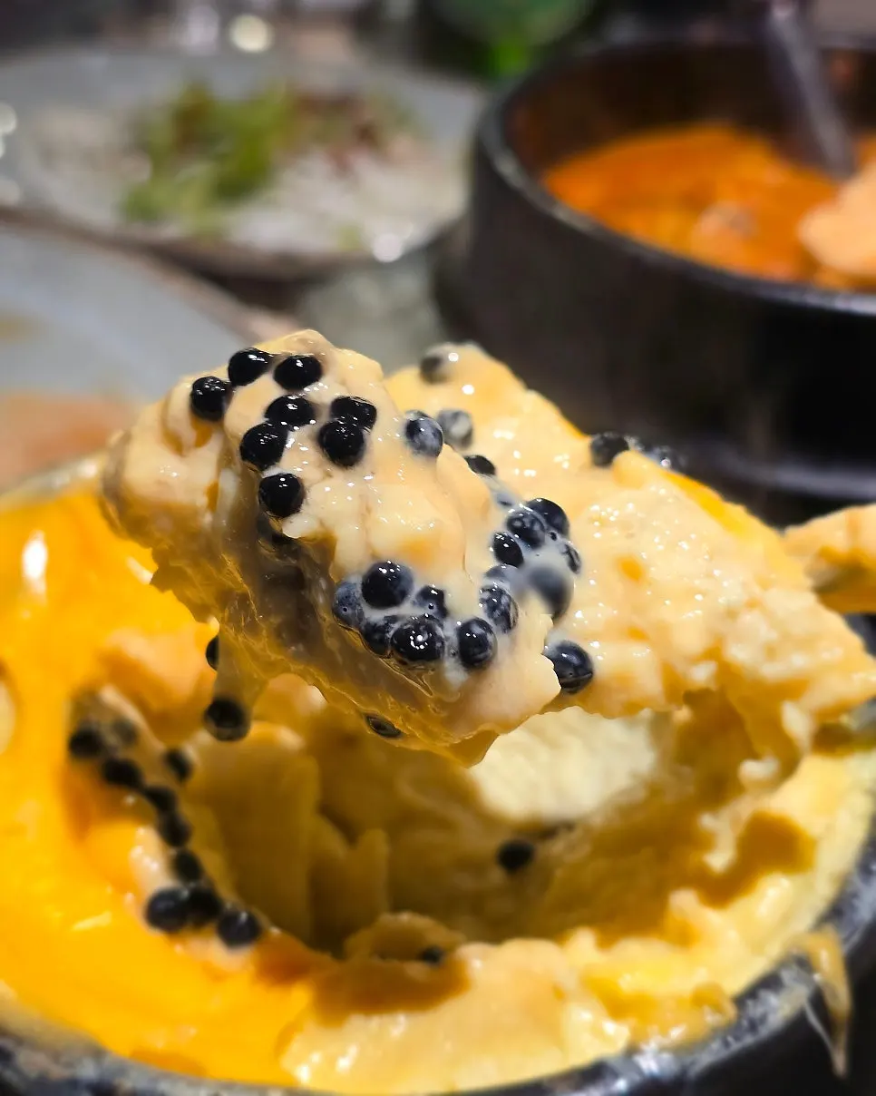 Caviar cheese egg custard covered in melted cheese