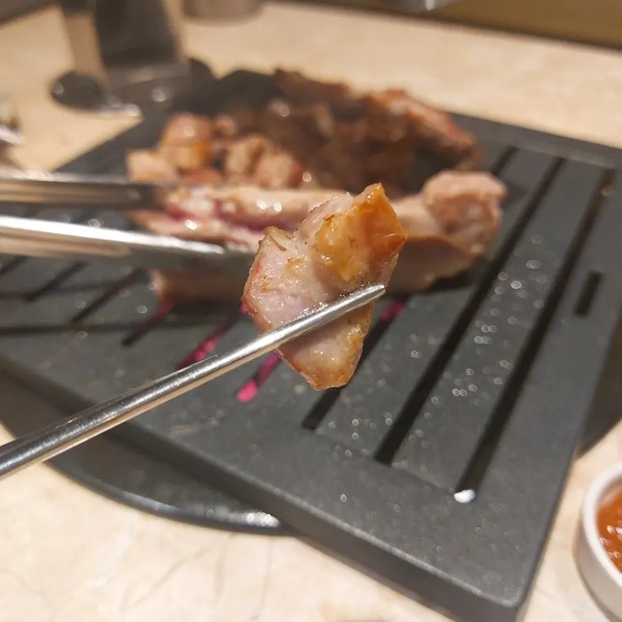 Pork neck grilled by staff