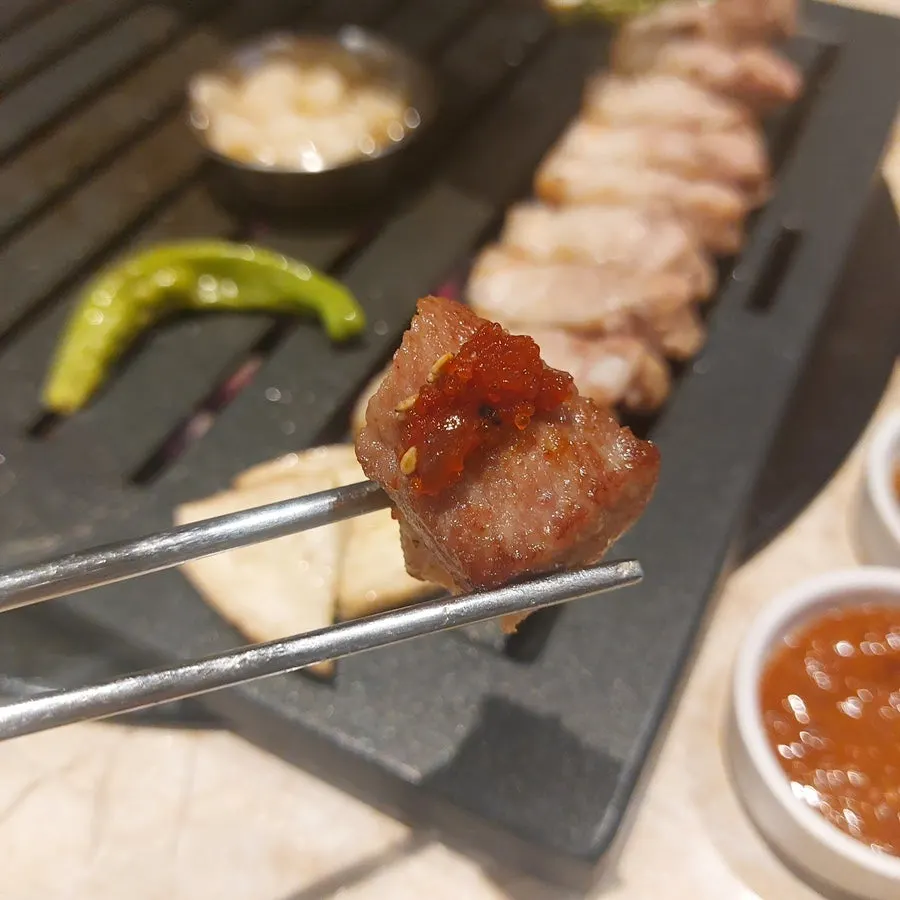 Grilled meat plated on an individual dish
