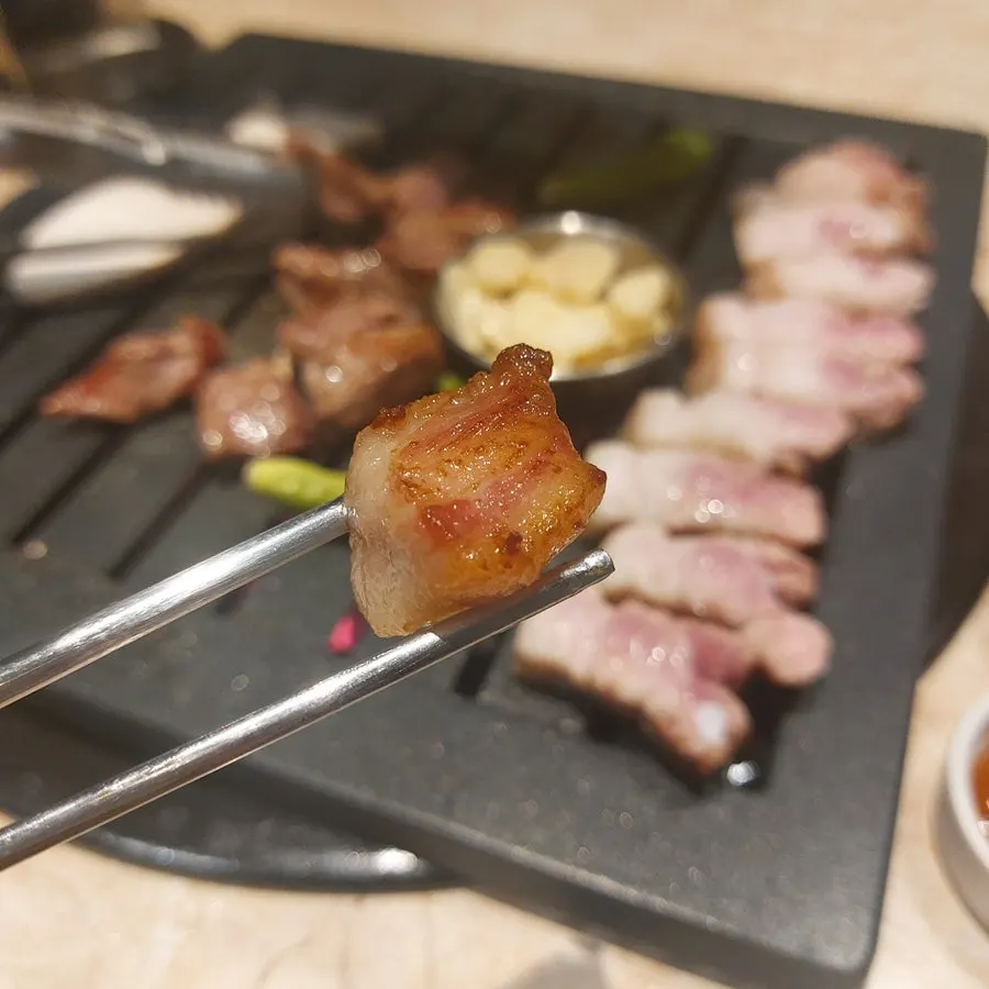Piece of pork neck topped with wasabi