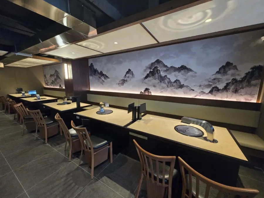 Dining hall with generous table spacing at Yukmong Bangi Direct Branch
