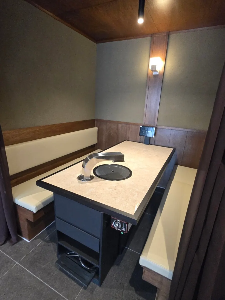 Table and grill setup at Yukmong Bangi Direct Branch