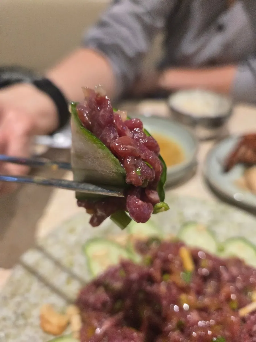Beef tartare topped with egg yolk