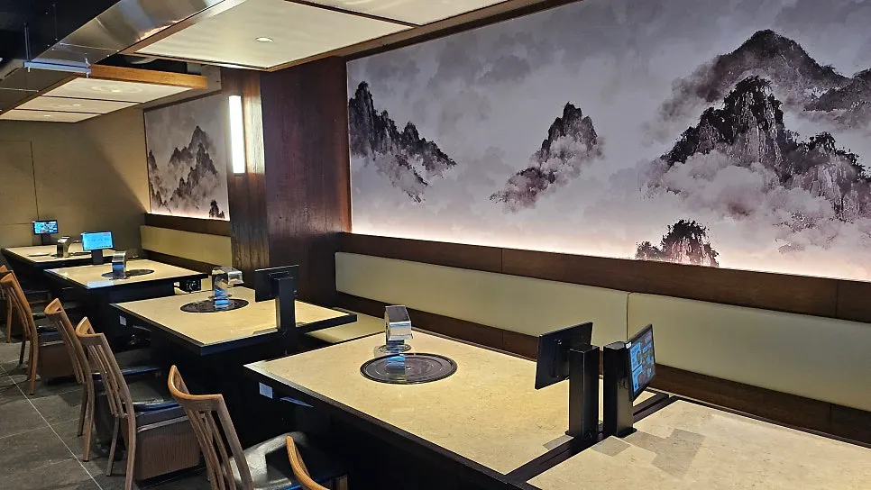 Table seating with built-in grill at Yukmong Bangi Direct Branch