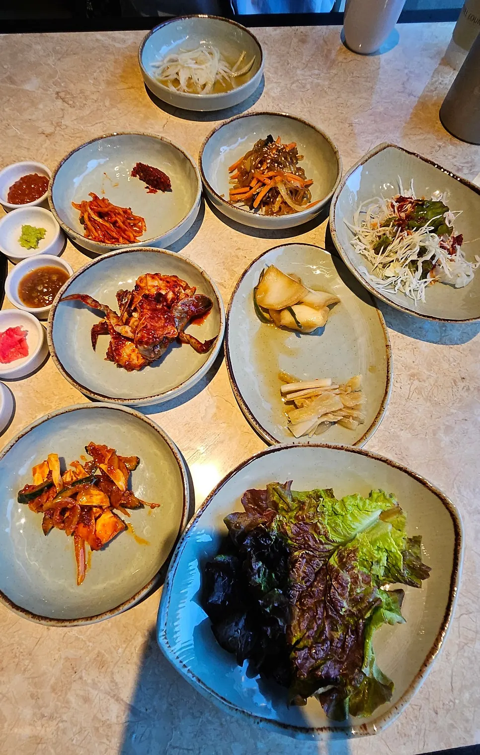 Vertical shot of basic side dishes and lettuce for wraps