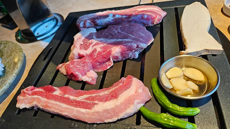 Snowflake pork neck grilling on the tableside grill