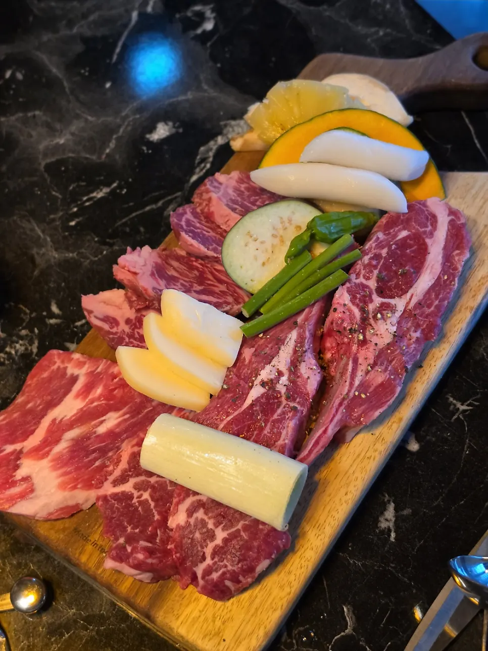 The 2-person set spread with galbisal, tosisal, lamb rack and grilling vegetables