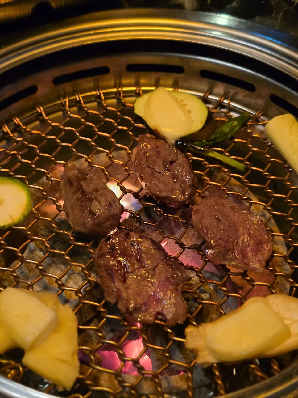 Tosisal grilling over charcoal