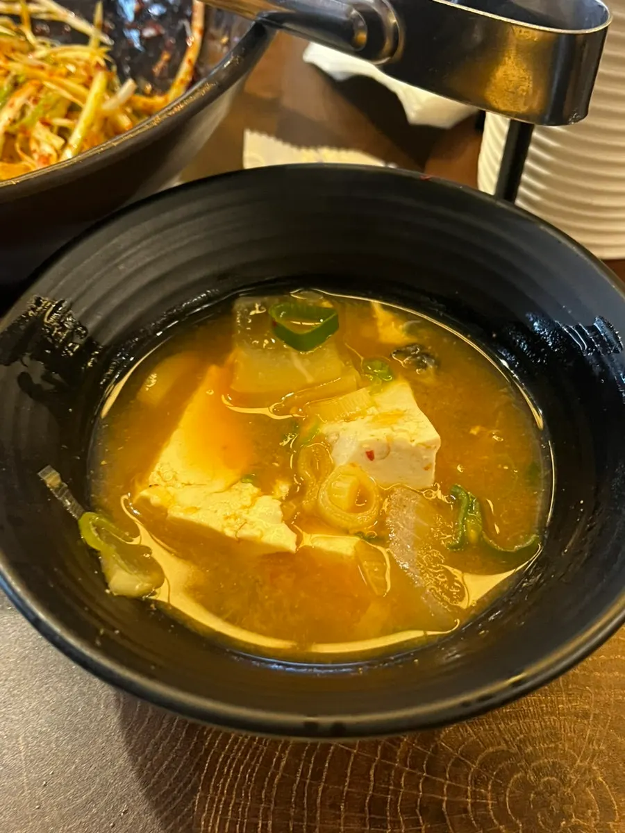 Close-up of pork jowl cooking