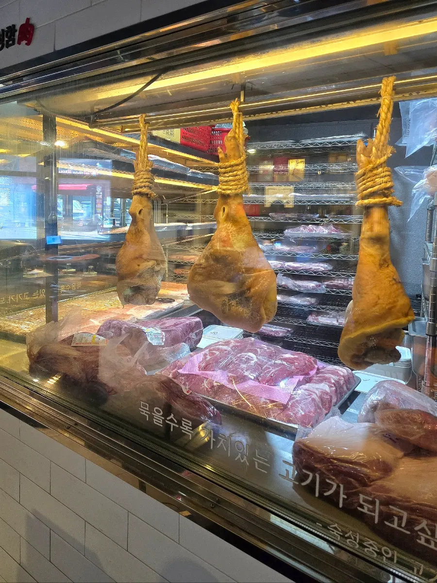 Aged black pork hanging in the aging room