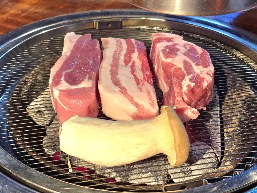 Three thickly sliced cuts of aged black pork