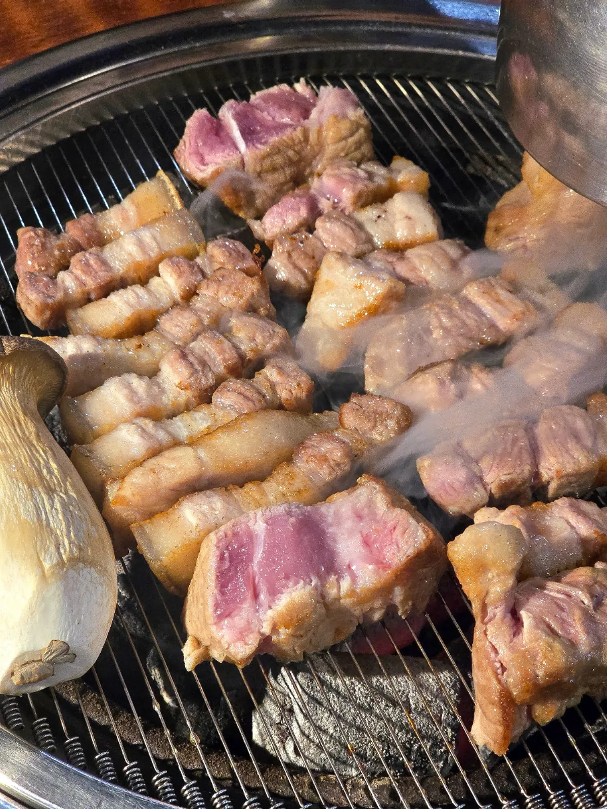 Black pork cooking with charcoal aroma soaking in