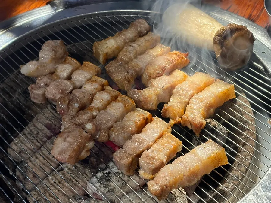 A piece of Yuk Tongryeong's samgyeopsal dipped in myeoljeot
