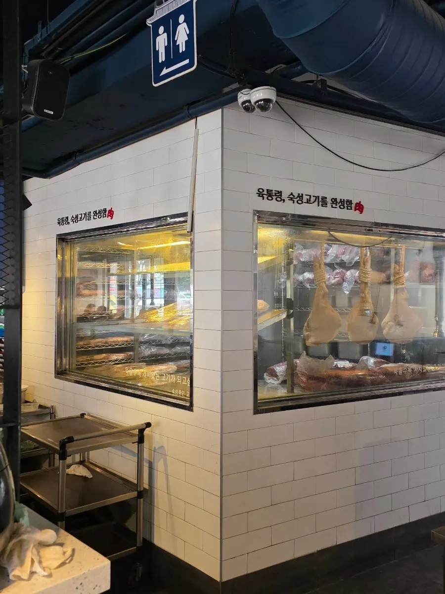 Meat aging area visible inside the restaurant