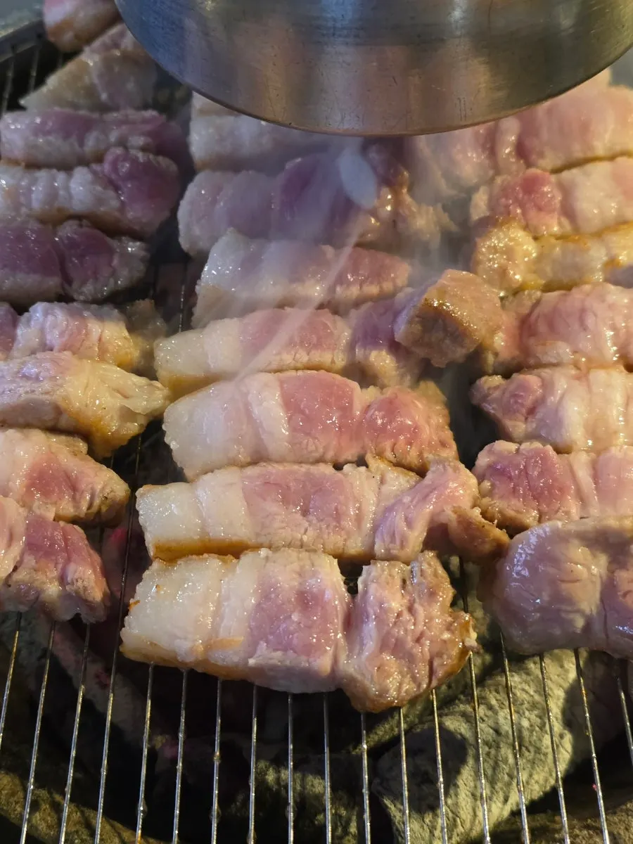 Pork belly cut into bite-sized pieces by staff