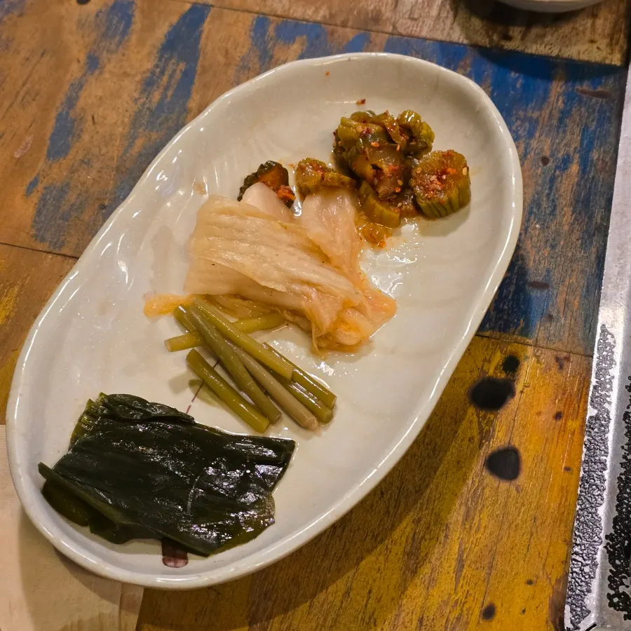 A meal of black pork with a bowl of rice