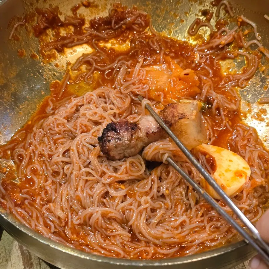 Bibim noodles served alongside the meat as a finishing dish