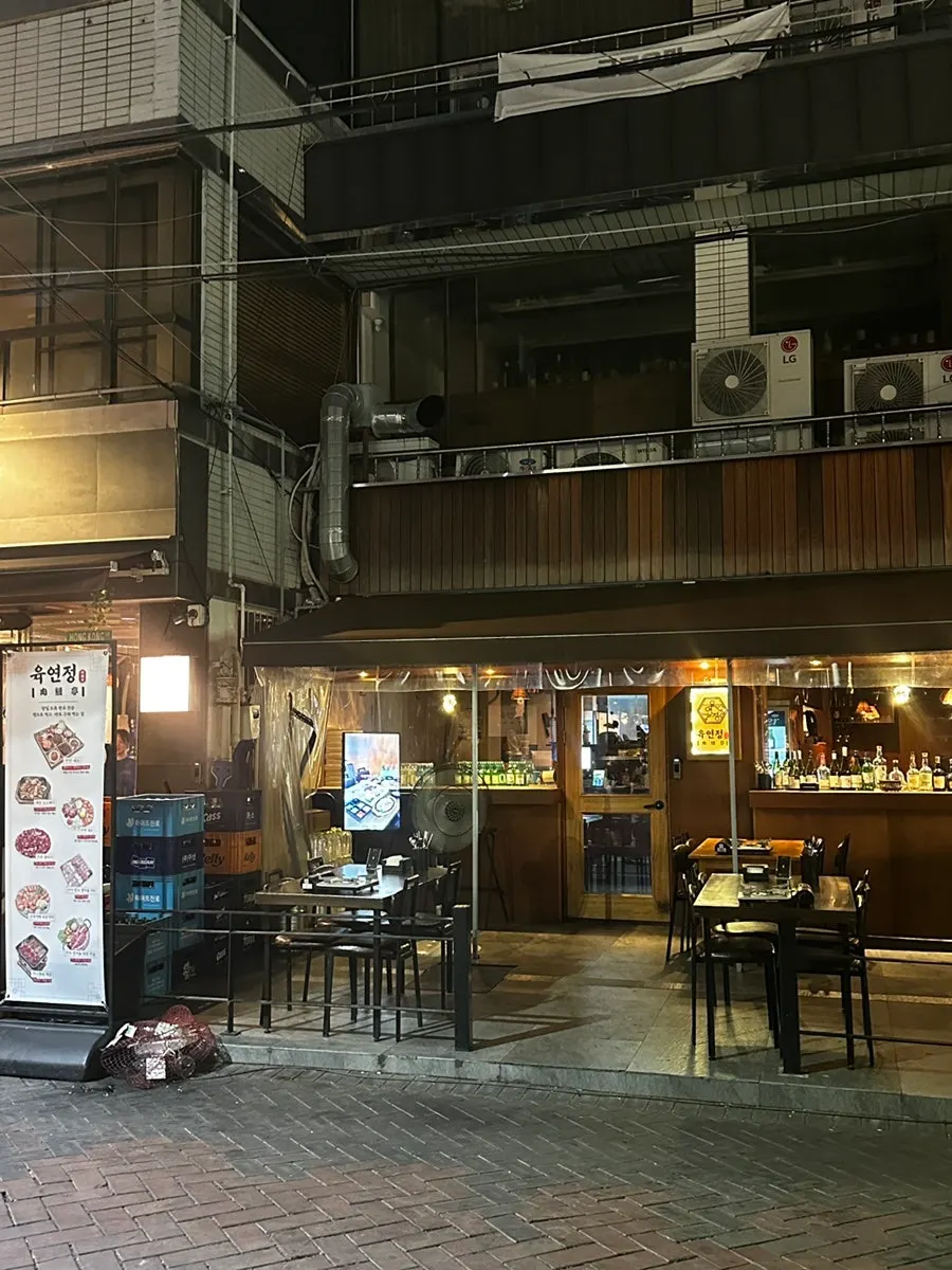 Exterior of Yukyeonjeong Gyodong with outdoor tables