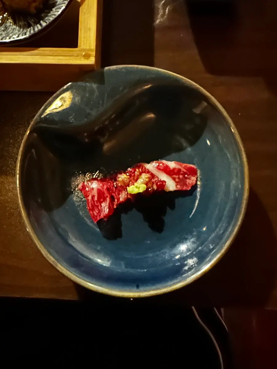 A piece of raw chadol served with wasabi